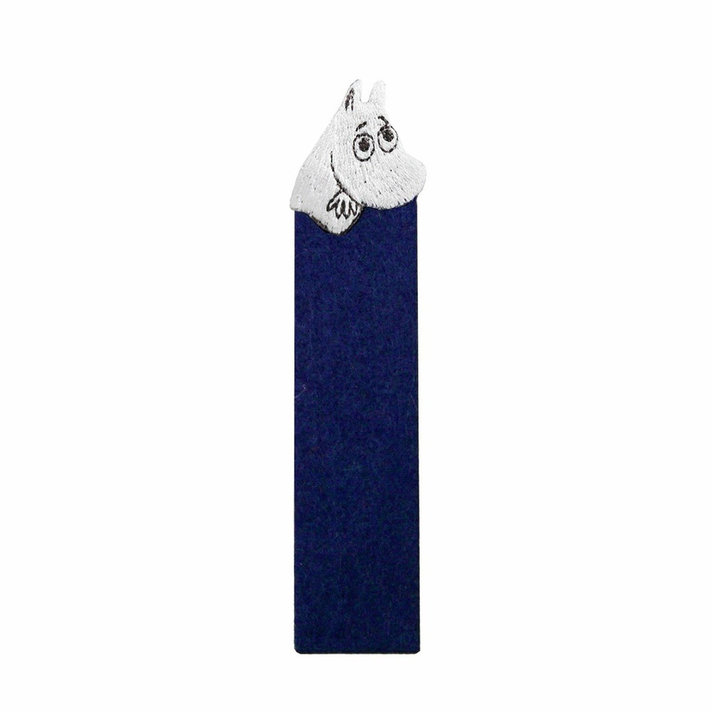 A blue bookmark with a white character resembling a cat's head peeking out from the top.