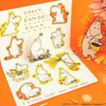 The image is a birthday card featuring illustrations of Moomin characters, including Moomin and Moomin's friends, along with a message and a small illustration of Moomin holding a yellow bucket.