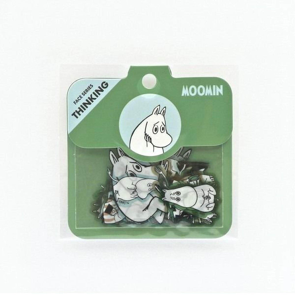 A package containing a cartoon character, specifically Moomin, with a green and white color scheme.