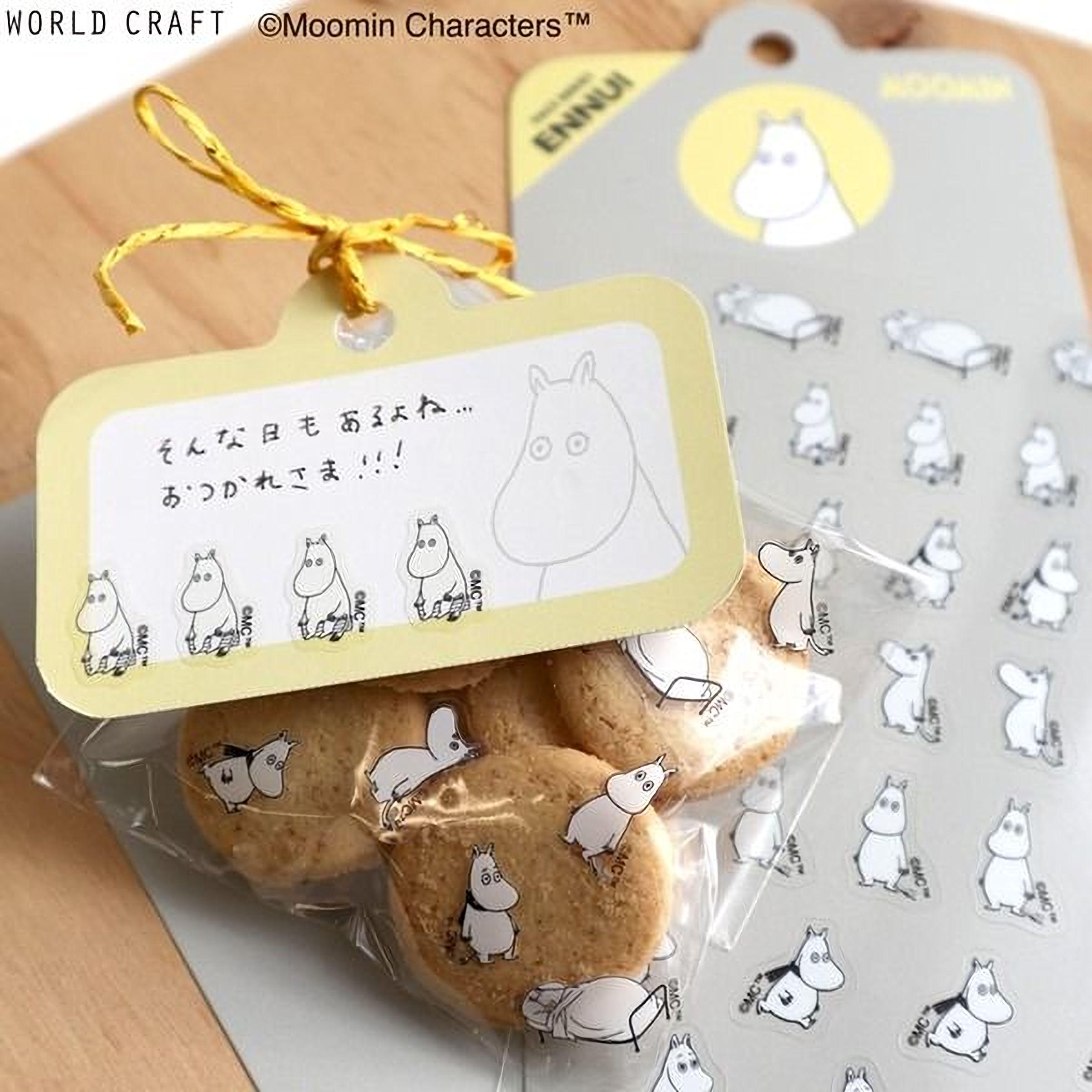 a package of cookies with a yellow label and a sticker of a character from the Moomin character series.