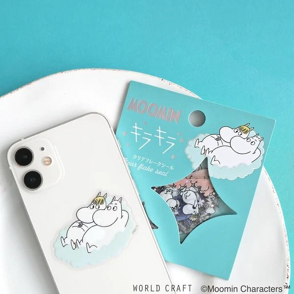 a white phone case with a cartoon character sticker on it, placed on a white plate against a teal background.