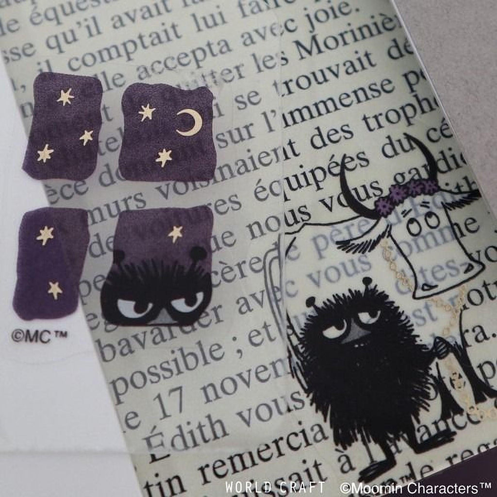 various stickers and illustrations, including a cow, a cat, and stars, all set against a background of text.