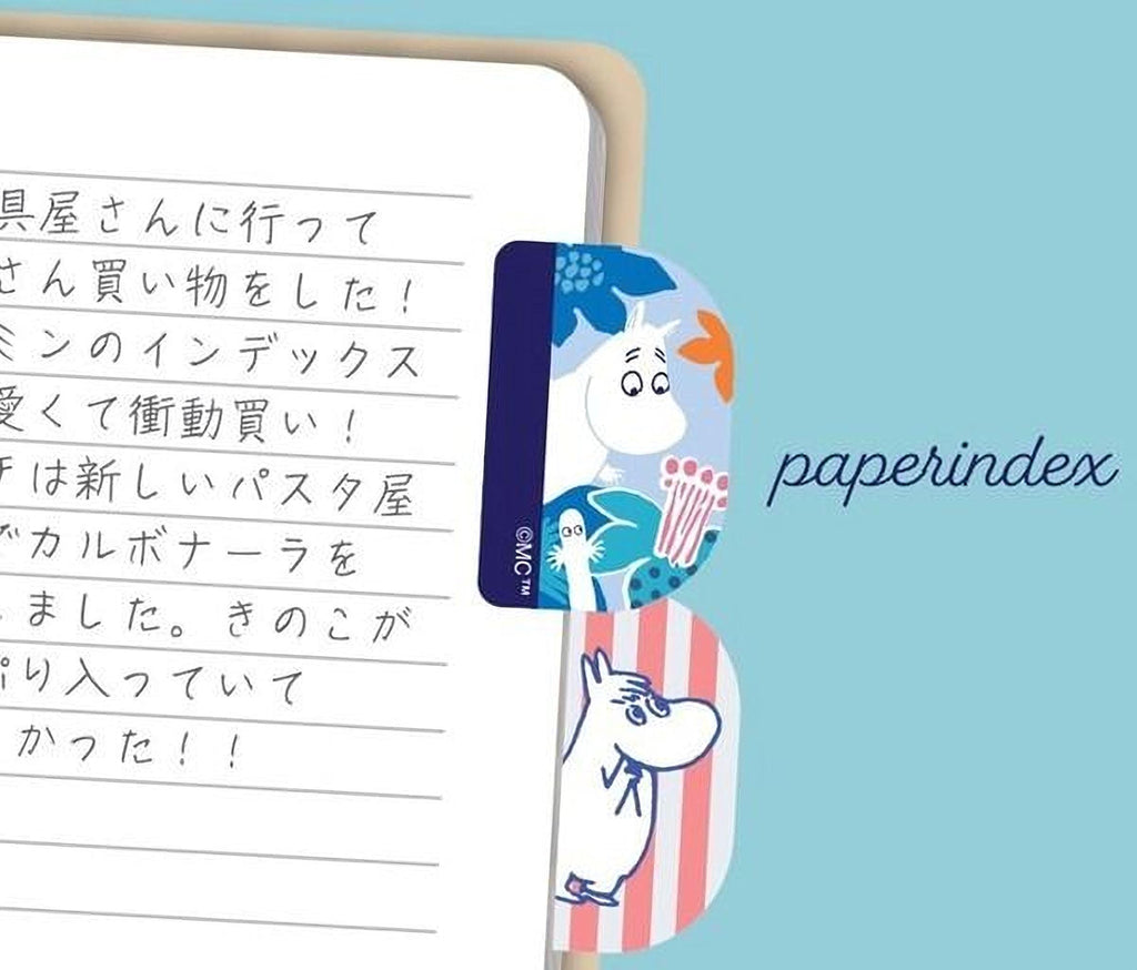 a page from a notebook with handwritten text in Japanese, and a paper index card with a cartoon character and the word "paperindex" printed on it.