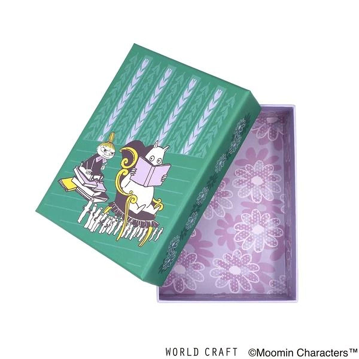 a green box with a floral pattern and illustrations of two cats, one reading a book.