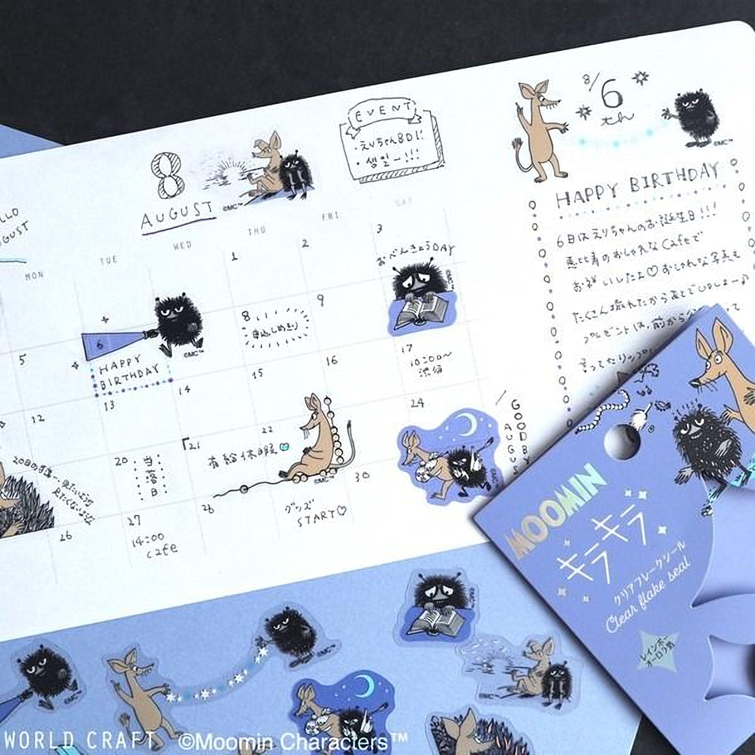 a calendar with various stickers and illustrations, including a kangaroo, hedgehog, and other animals, along with Japanese text. The calendar appears to be a creative and personalized item, possibly used for planning and organizing events or activities.