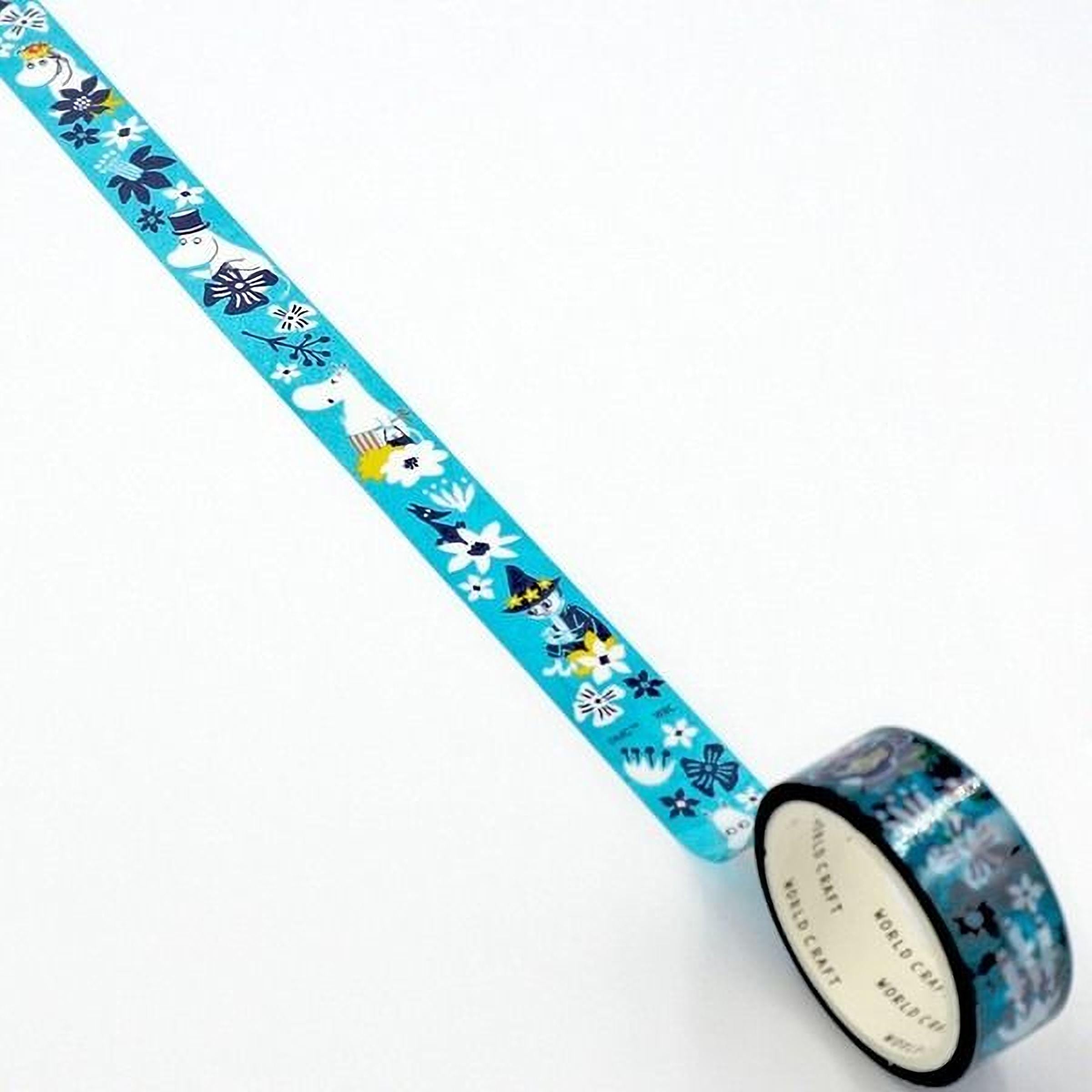 A roll of blue and white patterned tape with a repeating design of snowflakes, flowers, and other winter-themed elements.