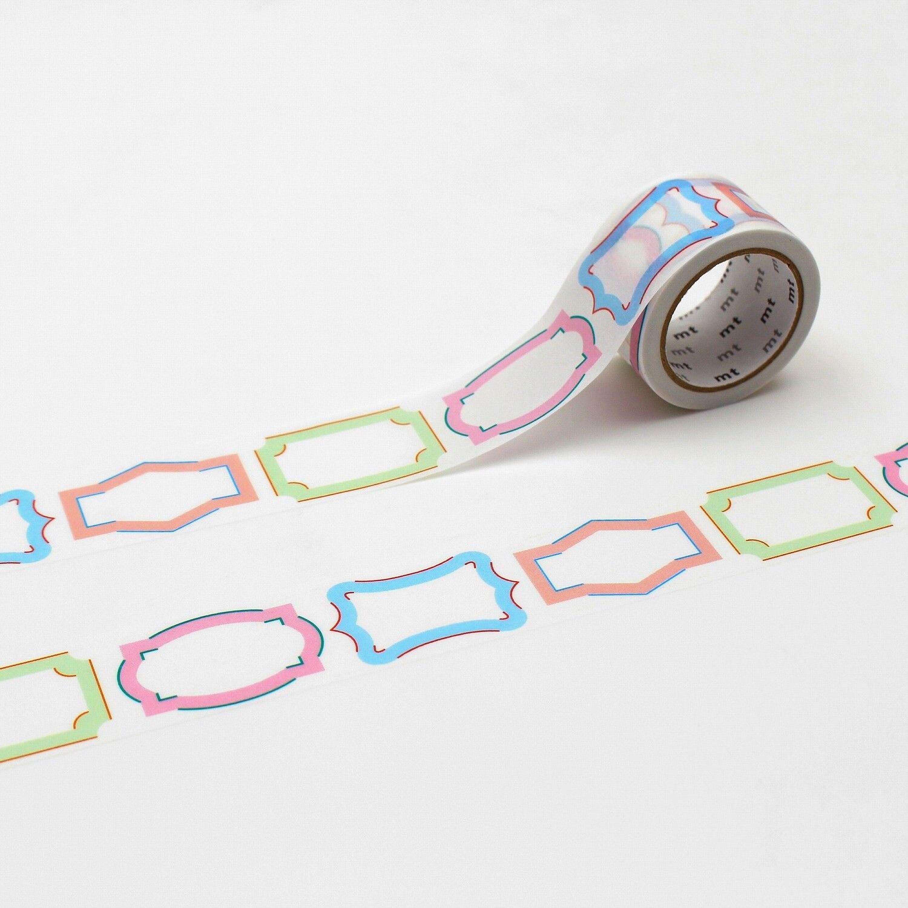a roll of colorful patterned tape with a repeating design of various shapes and colors, including pink, blue, green, and orange.
