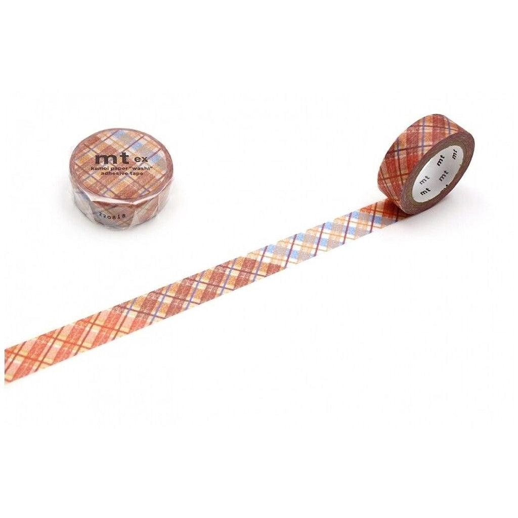 two rolls of tape with a plaid pattern, one roll is placed on the left side and the other roll is placed on the right side, both of which are lying on a white surface.