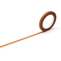 A roll of brown tape is lying on its side on a white background, with a long orange line extending from the tape.