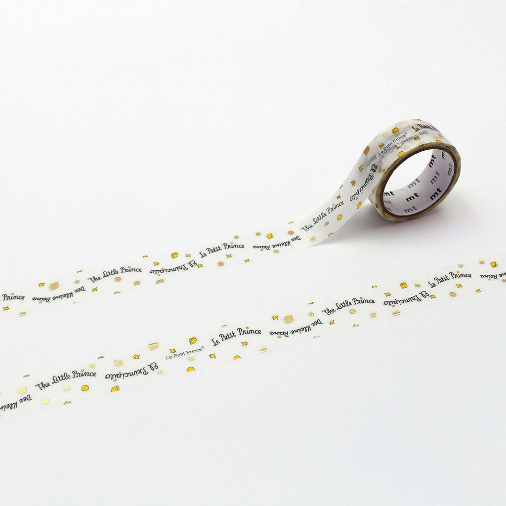 A roll of tape with the text "The Little Prince" printed on it, along with small stars and dots.