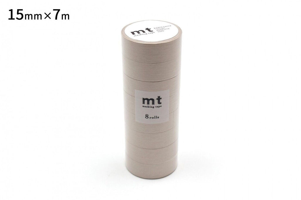 A cylindrical container of masking tape, with the label indicating it is "15mm x 7m" and "mt masking tape 8 rolls".