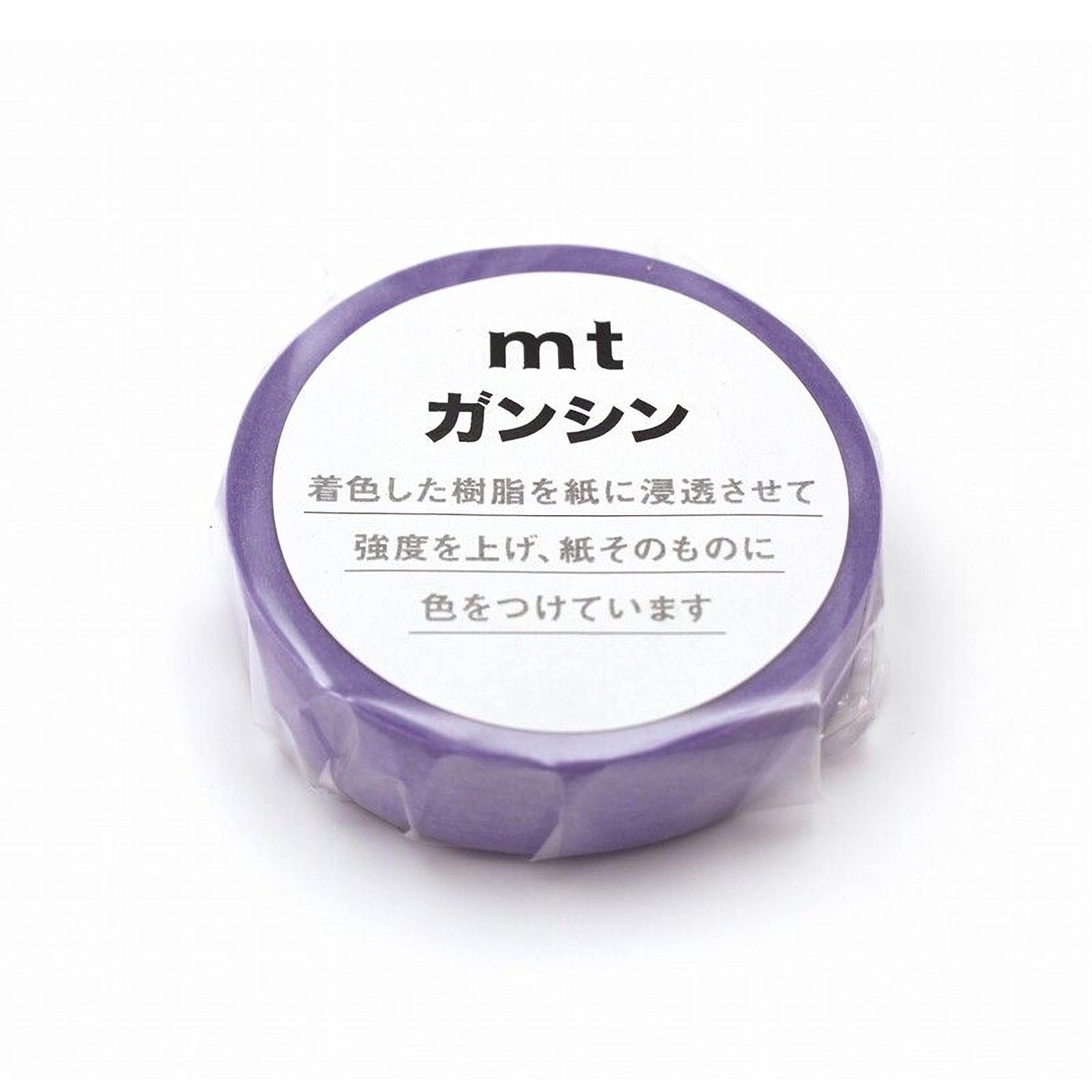 a purple object with Japanese text on it, which appears to be a product label or packaging.
