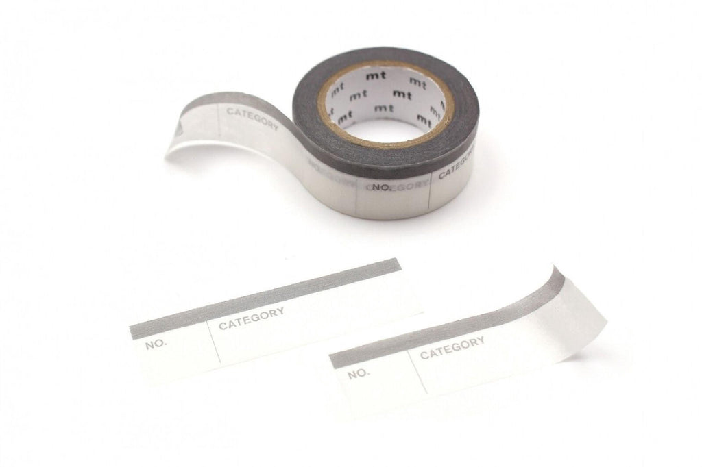 a roll of clear tape with a label on it, along with two additional labels.