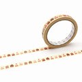 a roll of tape with a repeating pattern of cakes on it, placed on a white background.