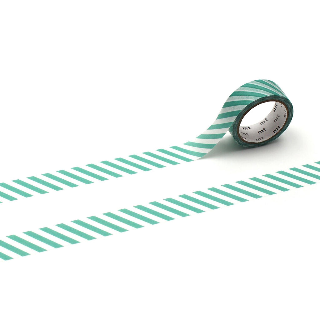 A roll of green and white striped tape is lying on a white background, with the tape partially unwinding and revealing the white backing.
