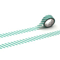 A roll of green and white striped tape is lying on a white background, with the tape partially unwinding and revealing the white backing.