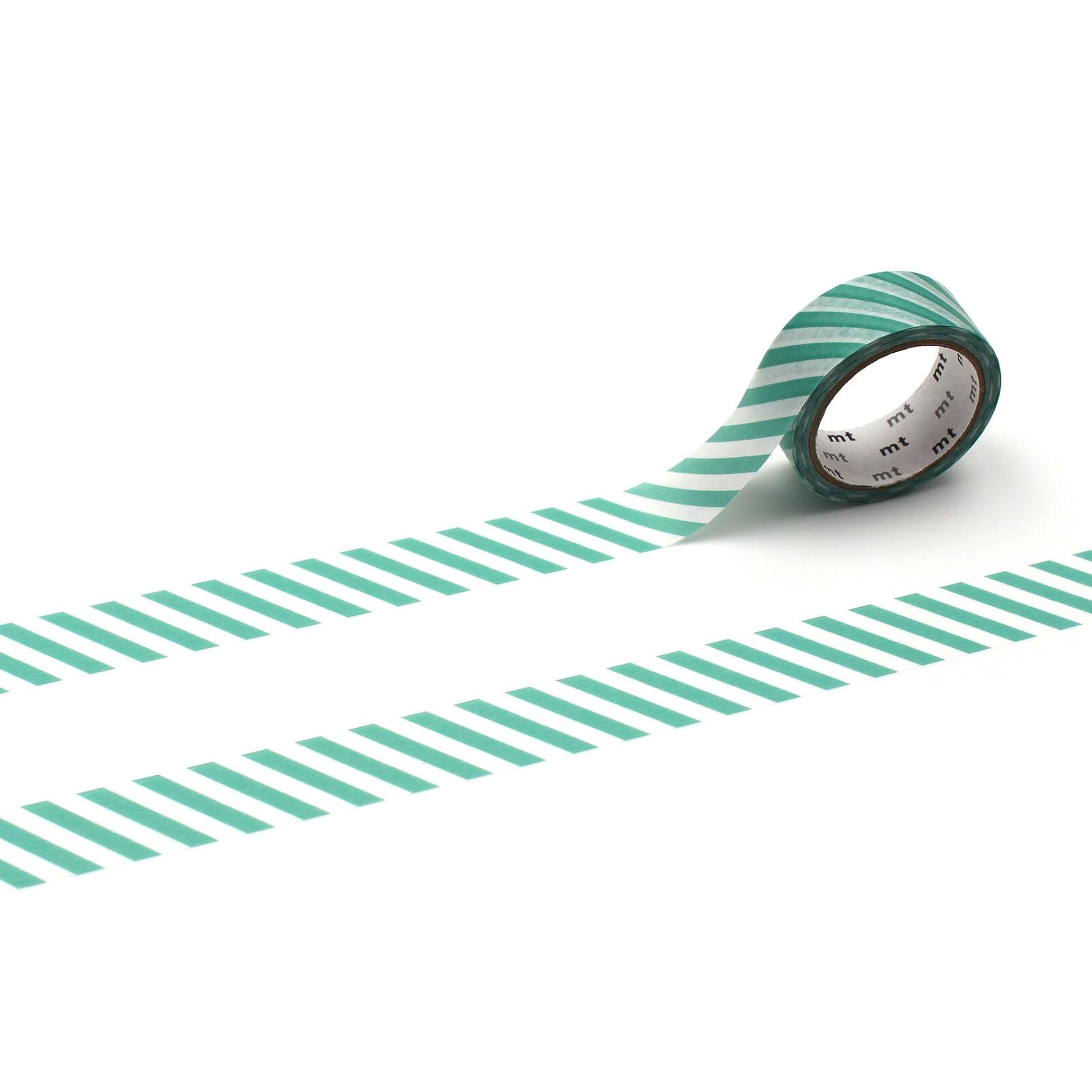 A roll of green and white striped tape is lying on a white background, with the tape partially unwinding and revealing the white backing.