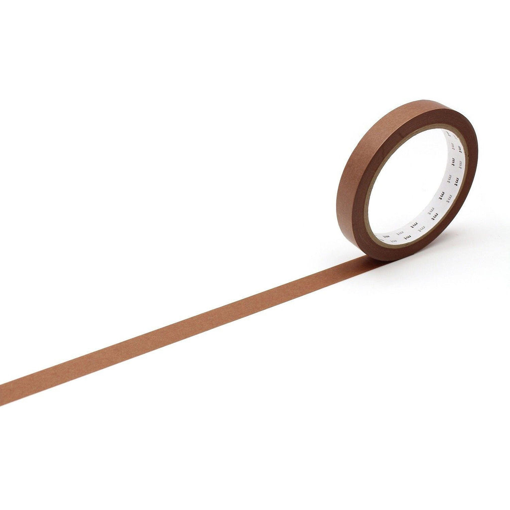 A roll of brown tape is lying on a white surface, with a long brown line extending from the tape.