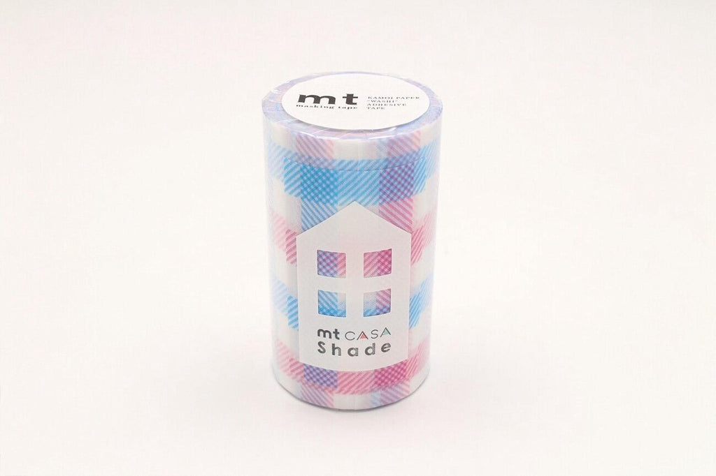 A cylindrical container with a plaid pattern and a label that reads "mt CASA Shade".