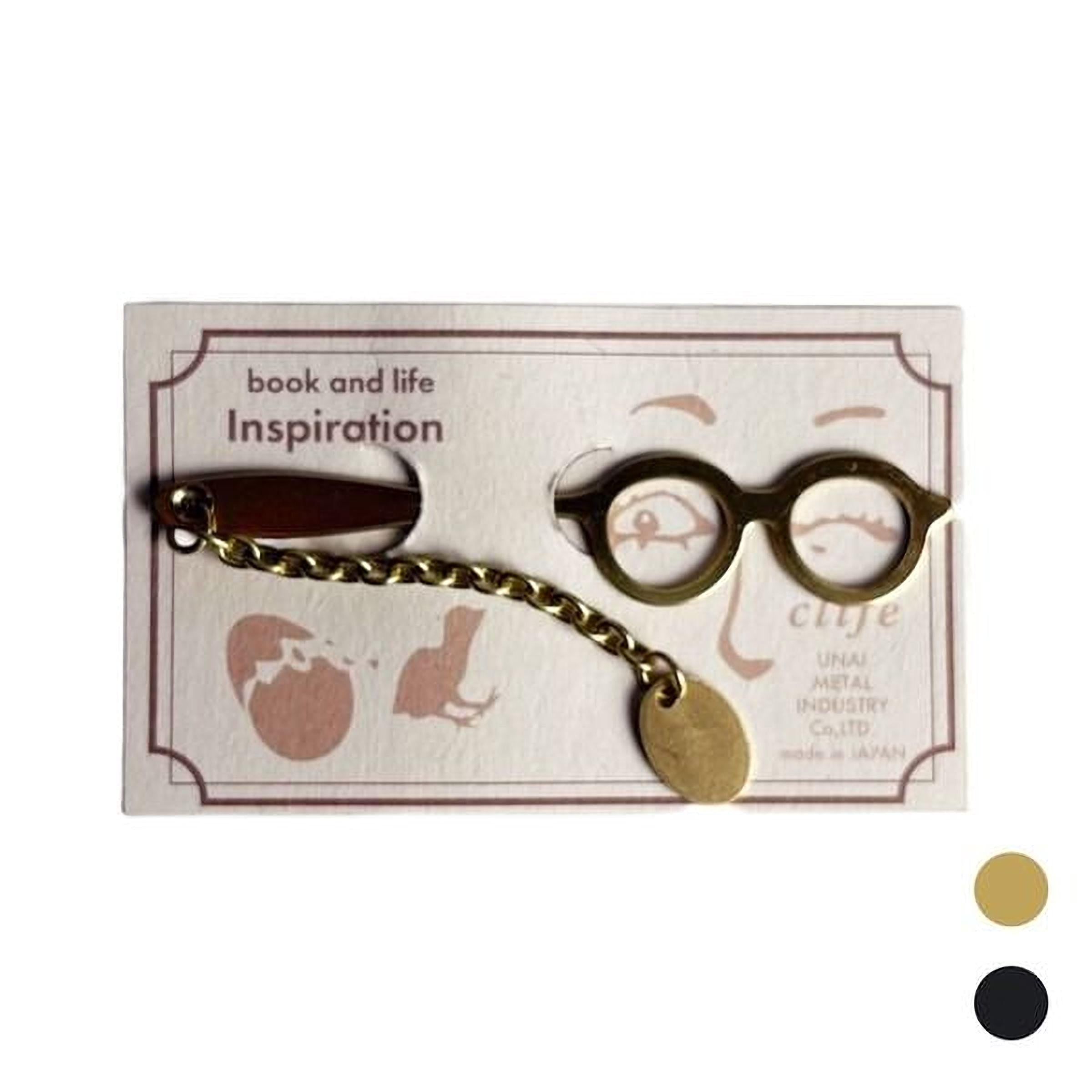 a pair of gold-colored glasses with a chain attached to it, displayed on a white background.