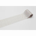 A roll of patterned tape with a repeating hexagonal design on a white background.