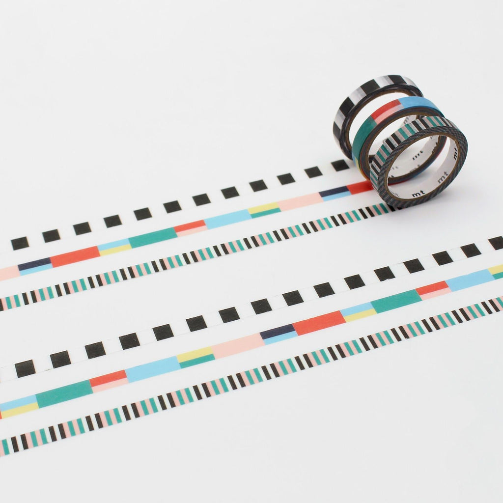 a roll of colorful patterned tape with a variety of stripes and designs, including black and white stripes, geometric shapes, and a mix of pastel colors.