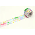 A roll of colorful tape with a geometric pattern on it, lying on a white surface.
