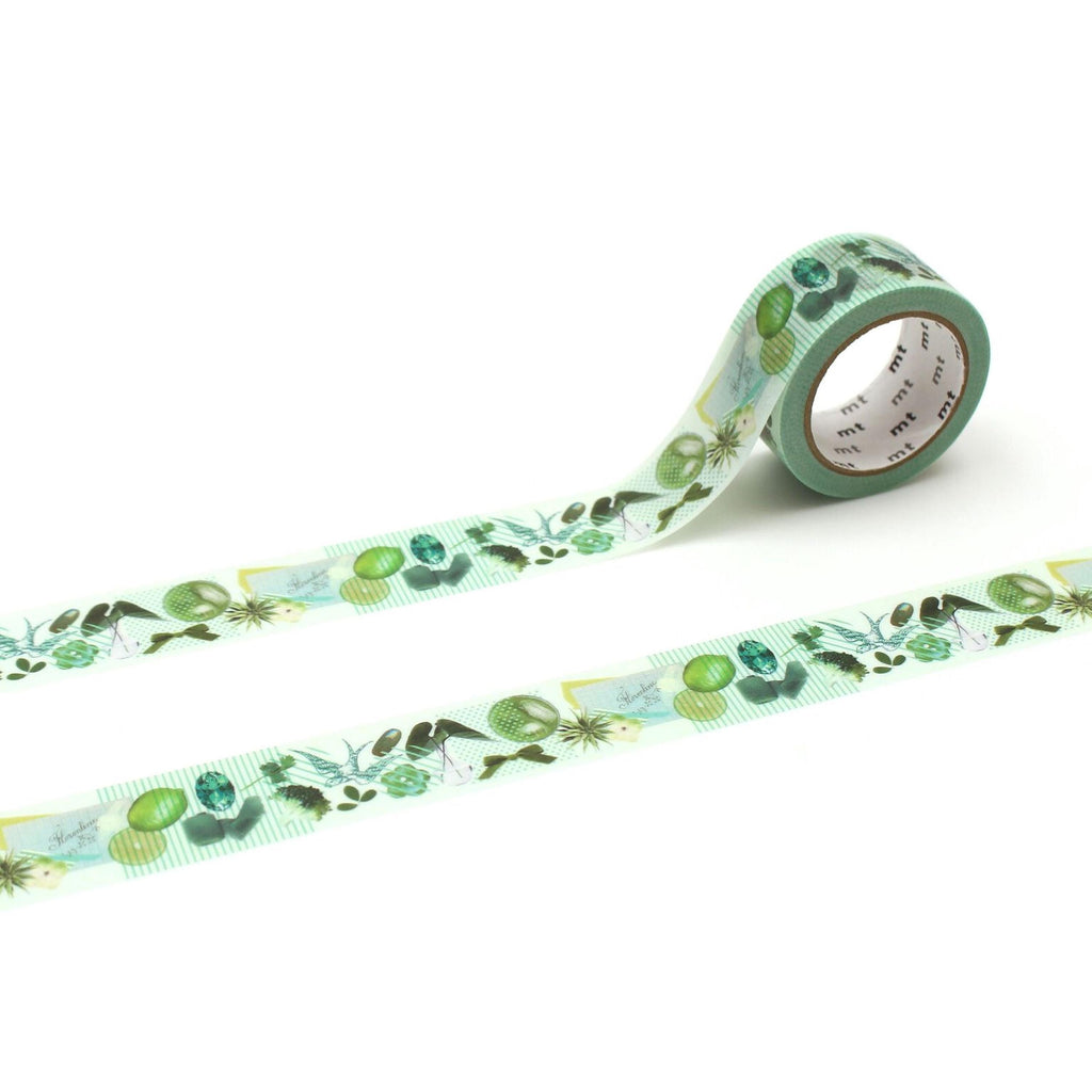 a roll of green and white patterned tape with various plant and leaf designs.