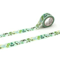 a roll of green and white patterned tape with various plant and leaf designs.
