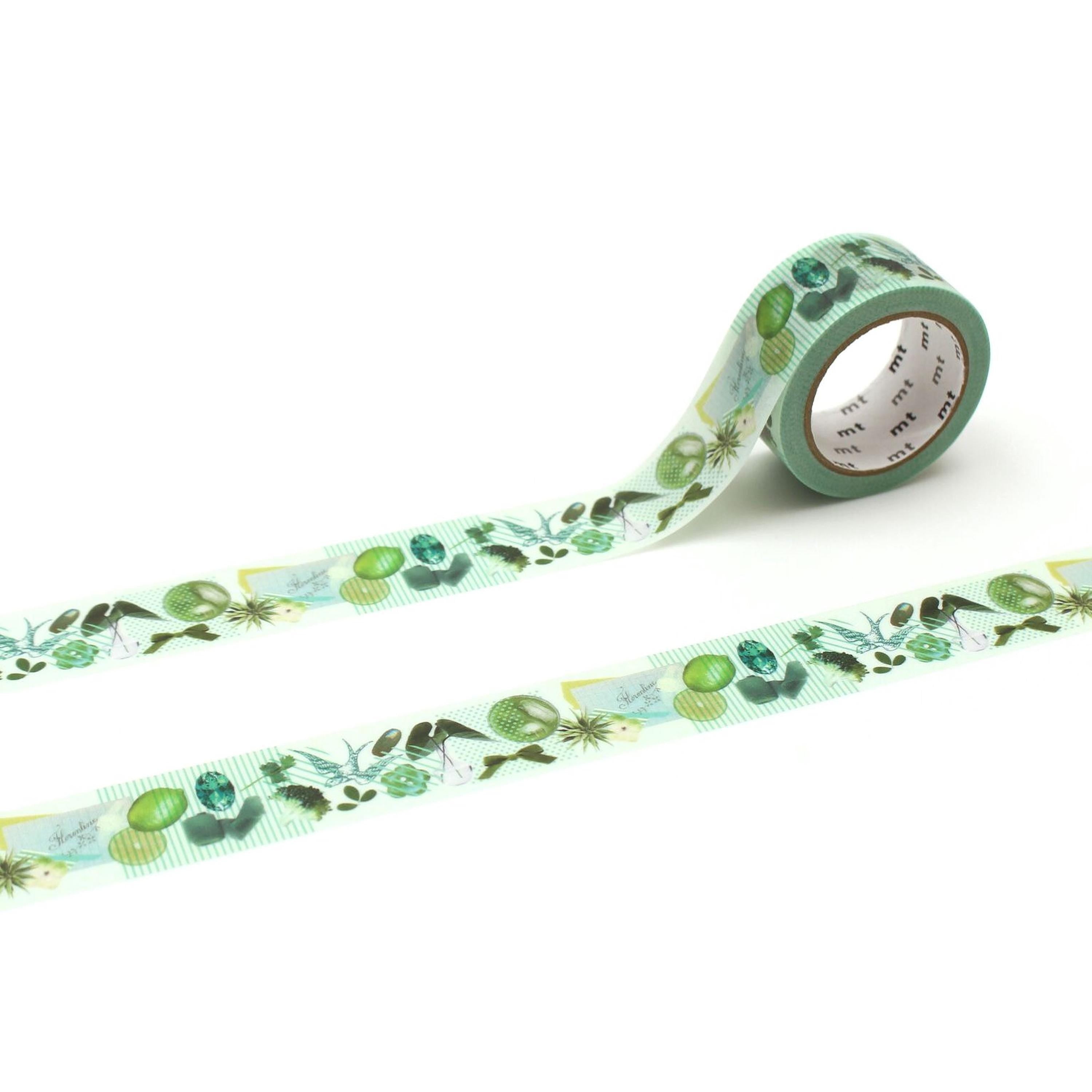 a roll of green and white patterned tape with various plant and leaf designs.