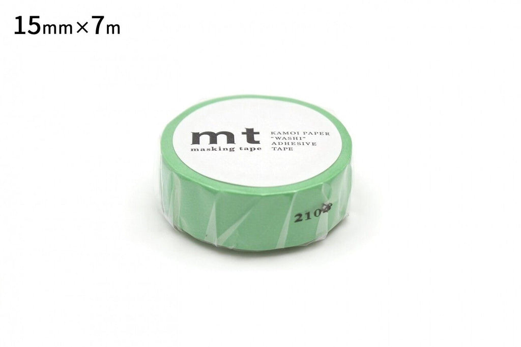 A roll of green masking tape with the text "mt" printed on it.