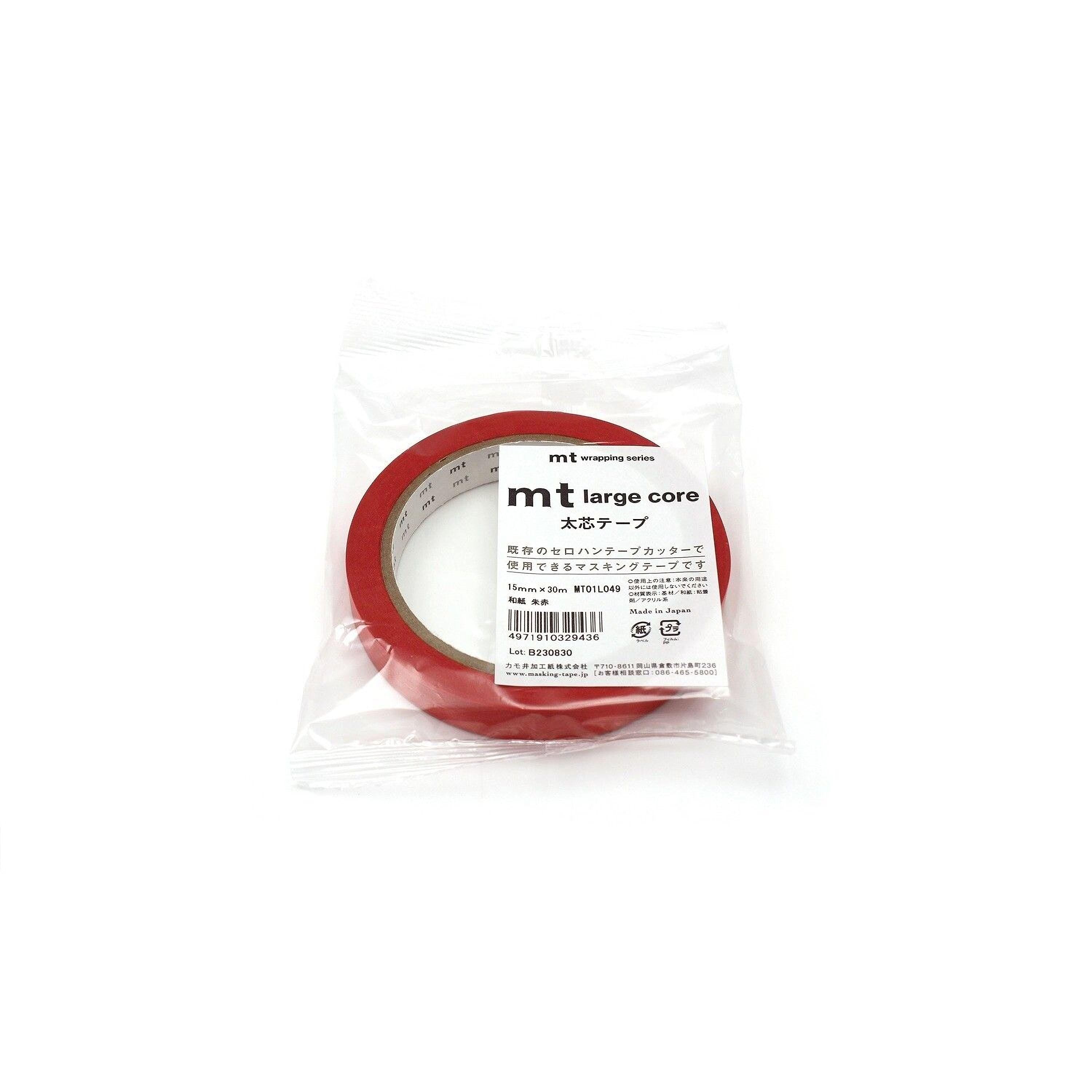 A package of red masking tape with Japanese text on it.