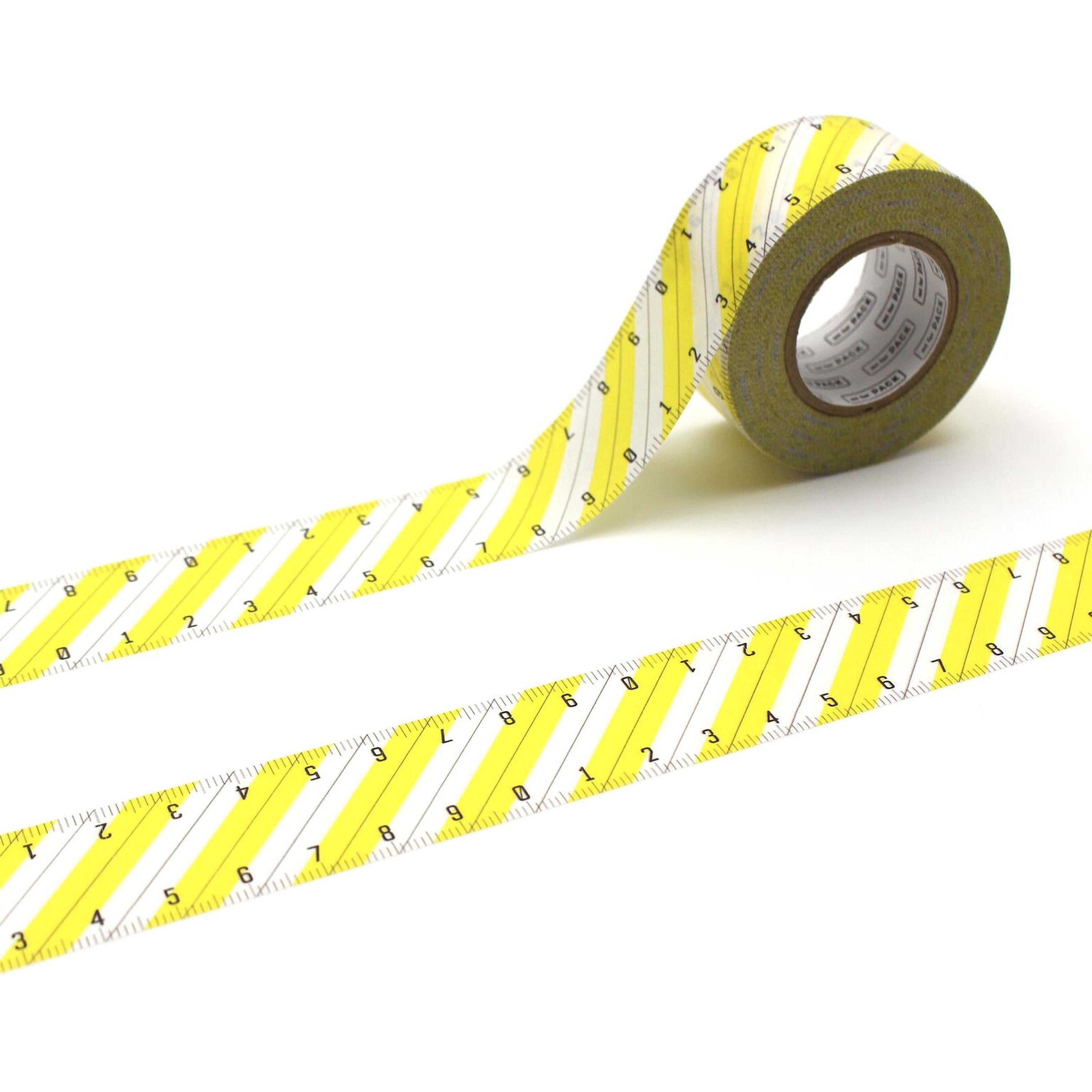 A roll of yellow and white measuring tape with a repeating diagonal pattern of numbers and lines.