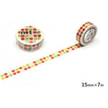 a roll of colorful apple-patterned tape and a roll of tape with a similar pattern, both lying on a white surface.