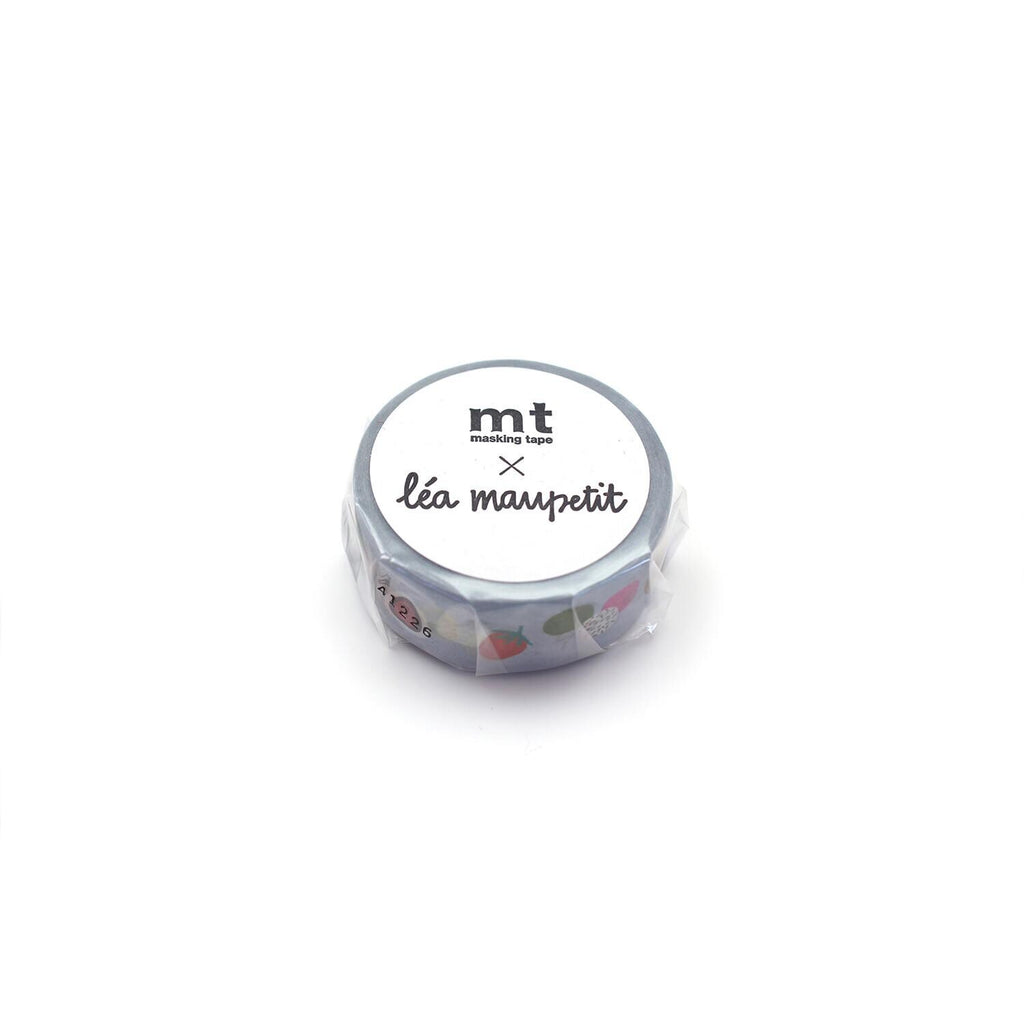 A silver-colored circular object with a label that reads "mt lea maupeit" and some colorful stickers on it.