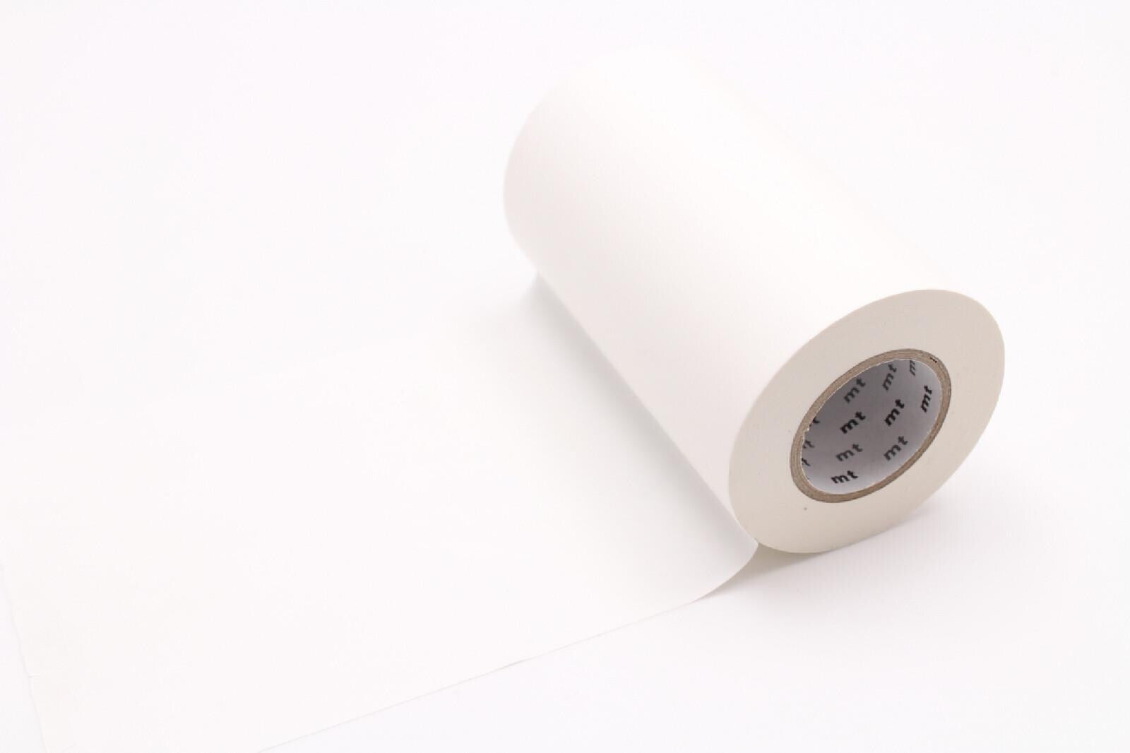 A roll of white paper tape is shown against a plain white background.
