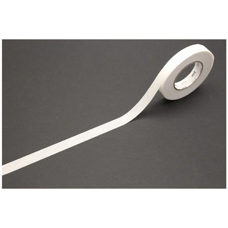 A roll of white tape is lying on a dark grey surface.