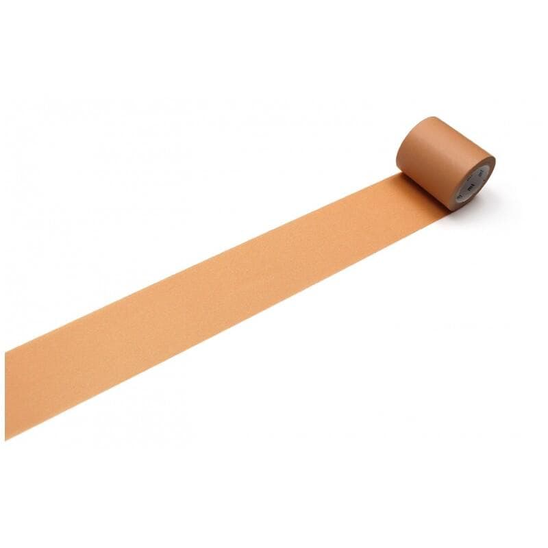 A roll of brown tape is lying on a white surface, with a single piece of tape visible.