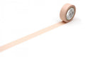 A roll of light pink tape is lying on a white surface, with a single line of tape extending from the top of the roll to the bottom.