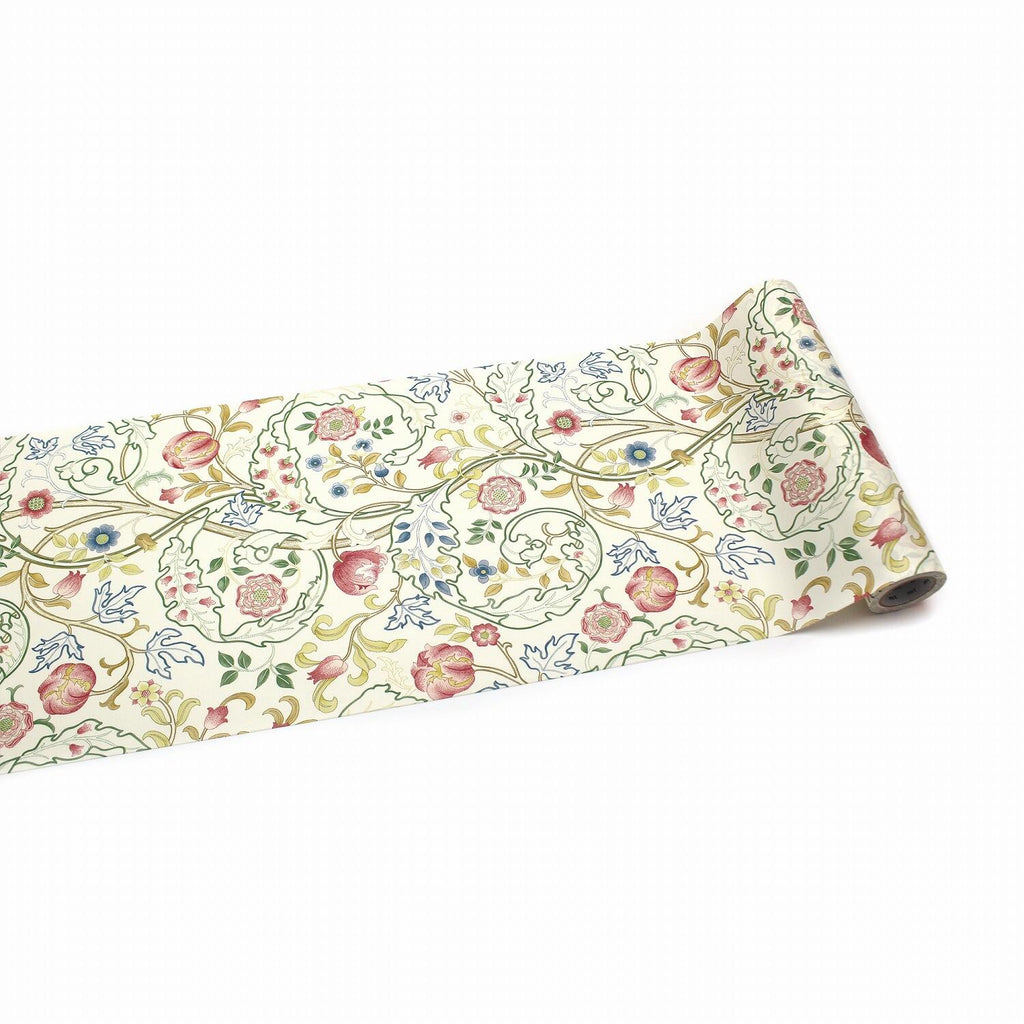 a roll of paper with a floral pattern on it, which appears to be a decorative paper or wallpaper.