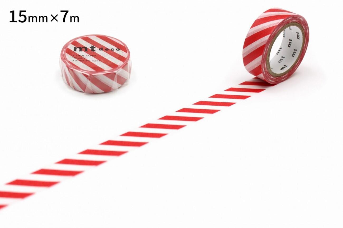 a roll of red and white striped tape with a label, placed on a white surface.