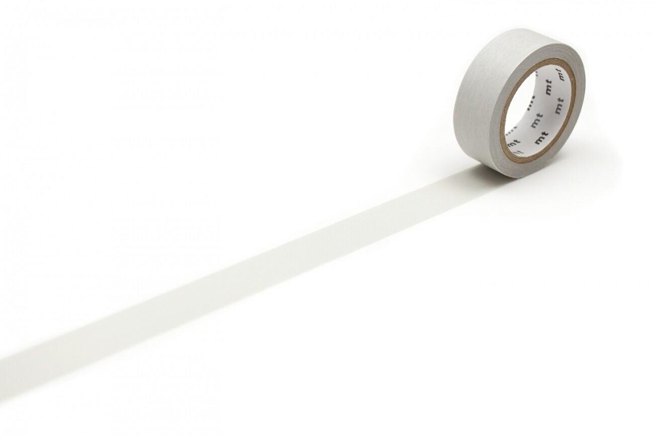 A roll of gray tape is lying on a white surface, with a shadow cast by the tape.