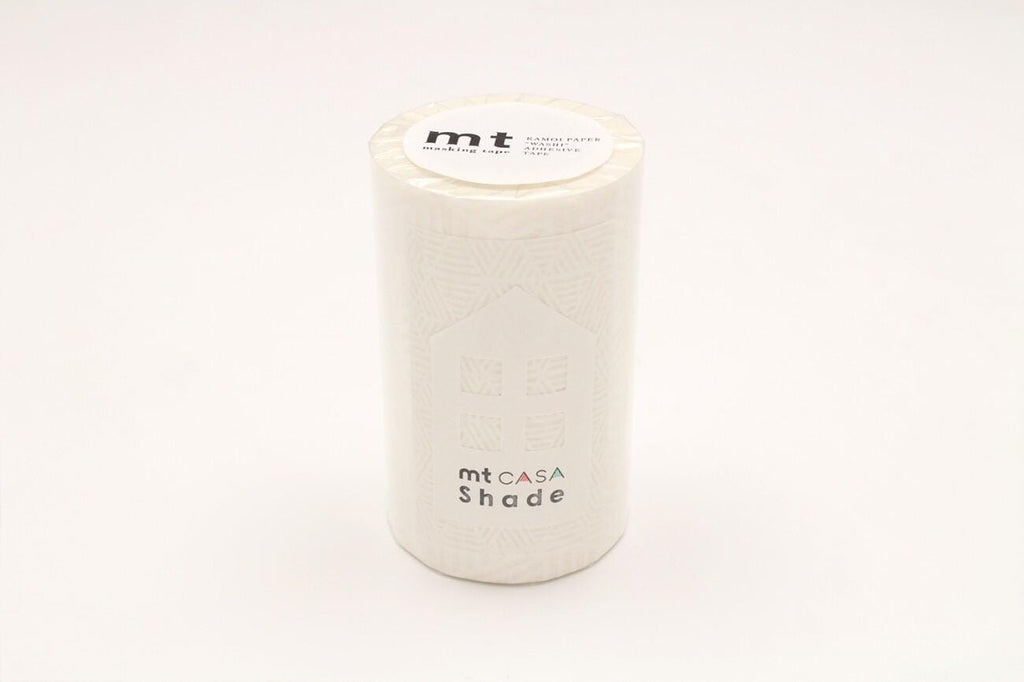 A cylindrical container with a label on top, which appears to be a product or packaging for a shade.