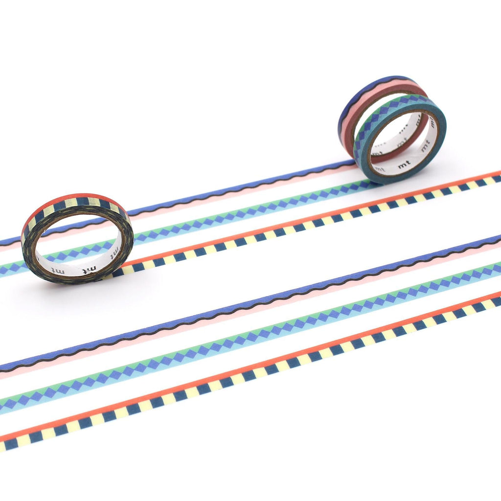 three rolls of colorful, patterned tape arranged on a white background.
