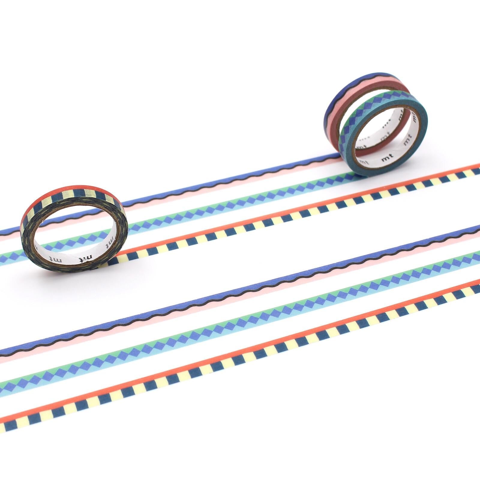 three rolls of colorful, patterned tape arranged on a white background.