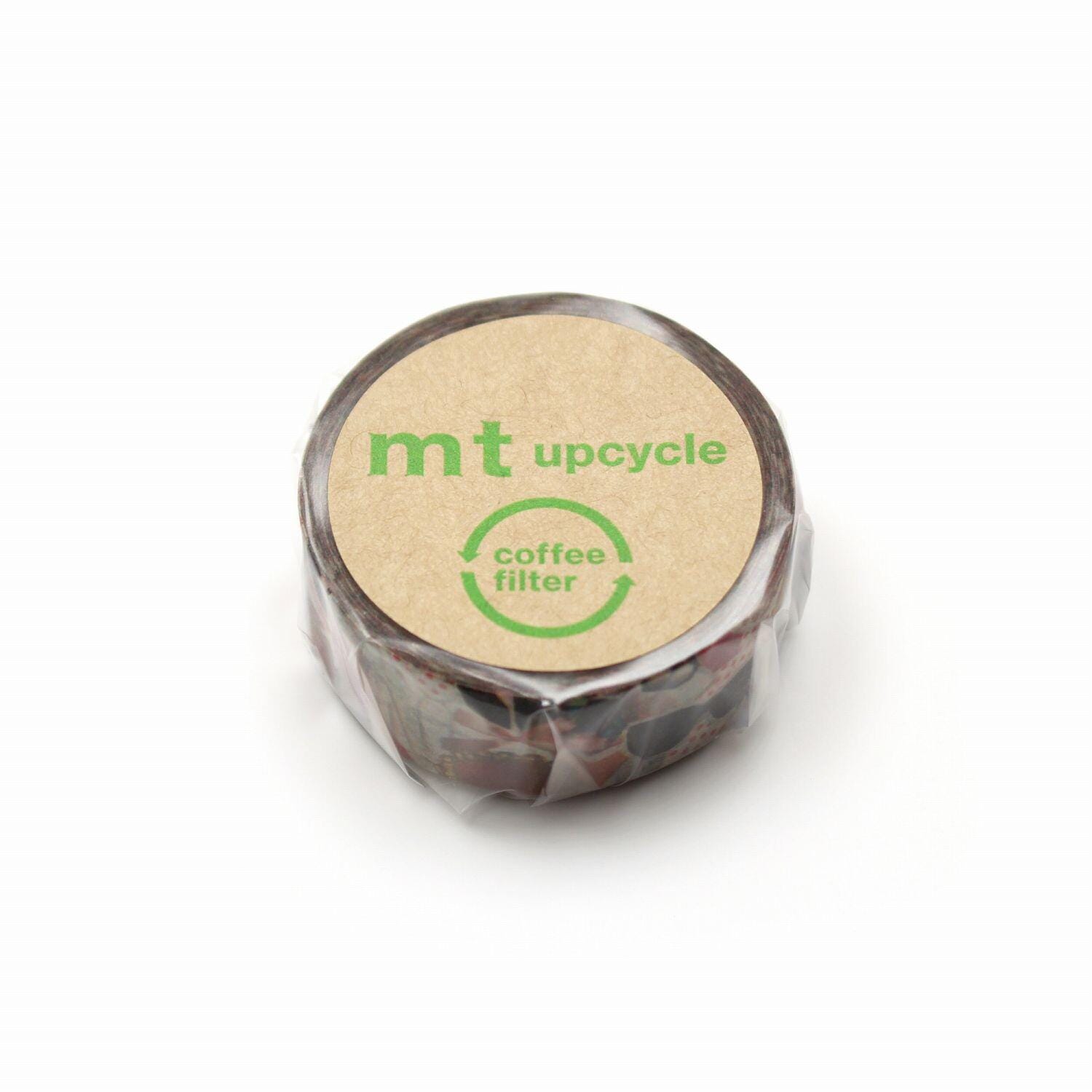 A circular object with a brown and green label that reads "mt upcycle coffee filter".