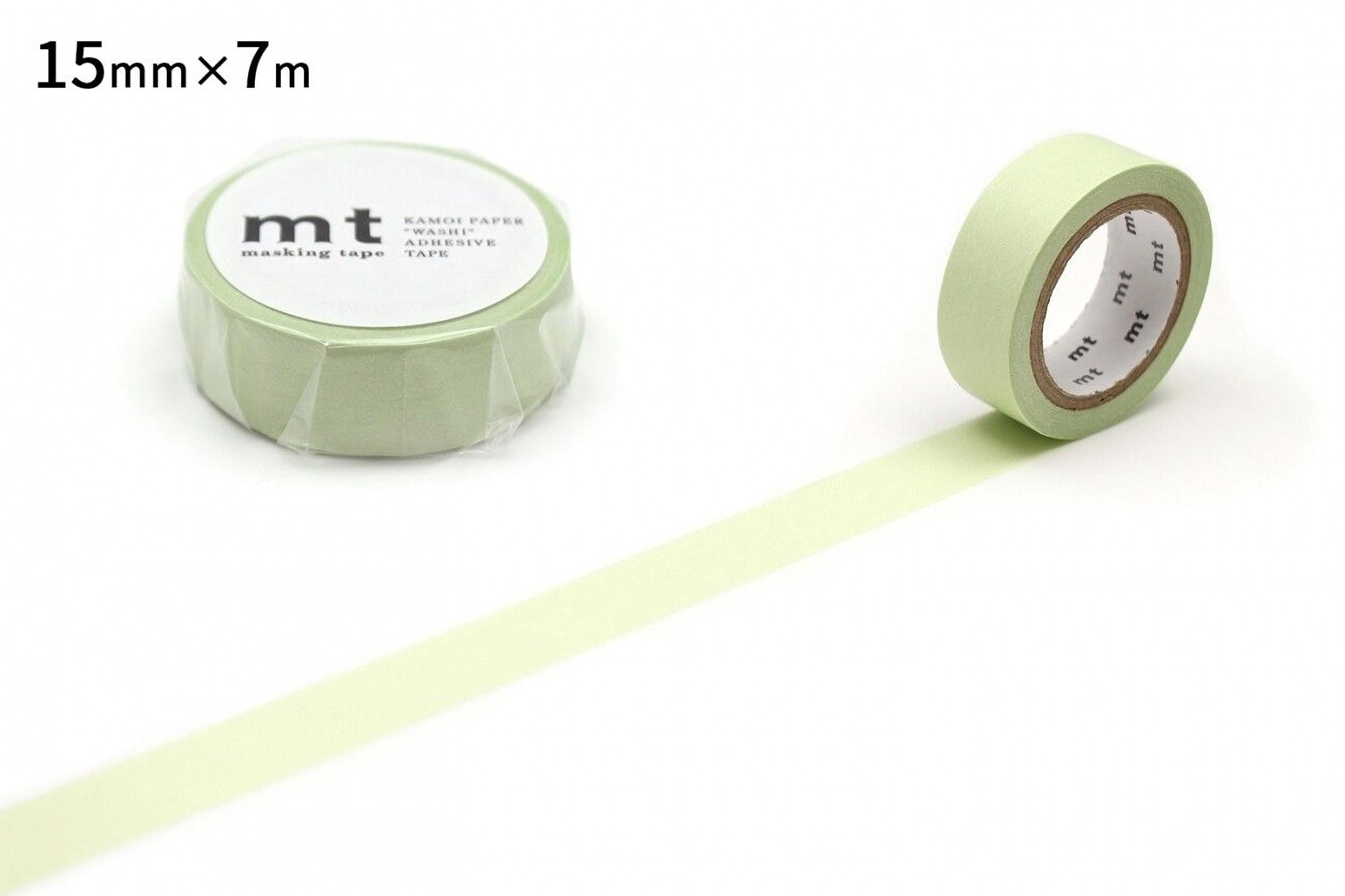 a roll of green masking tape and a single roll of the same tape, both lying on a white background.