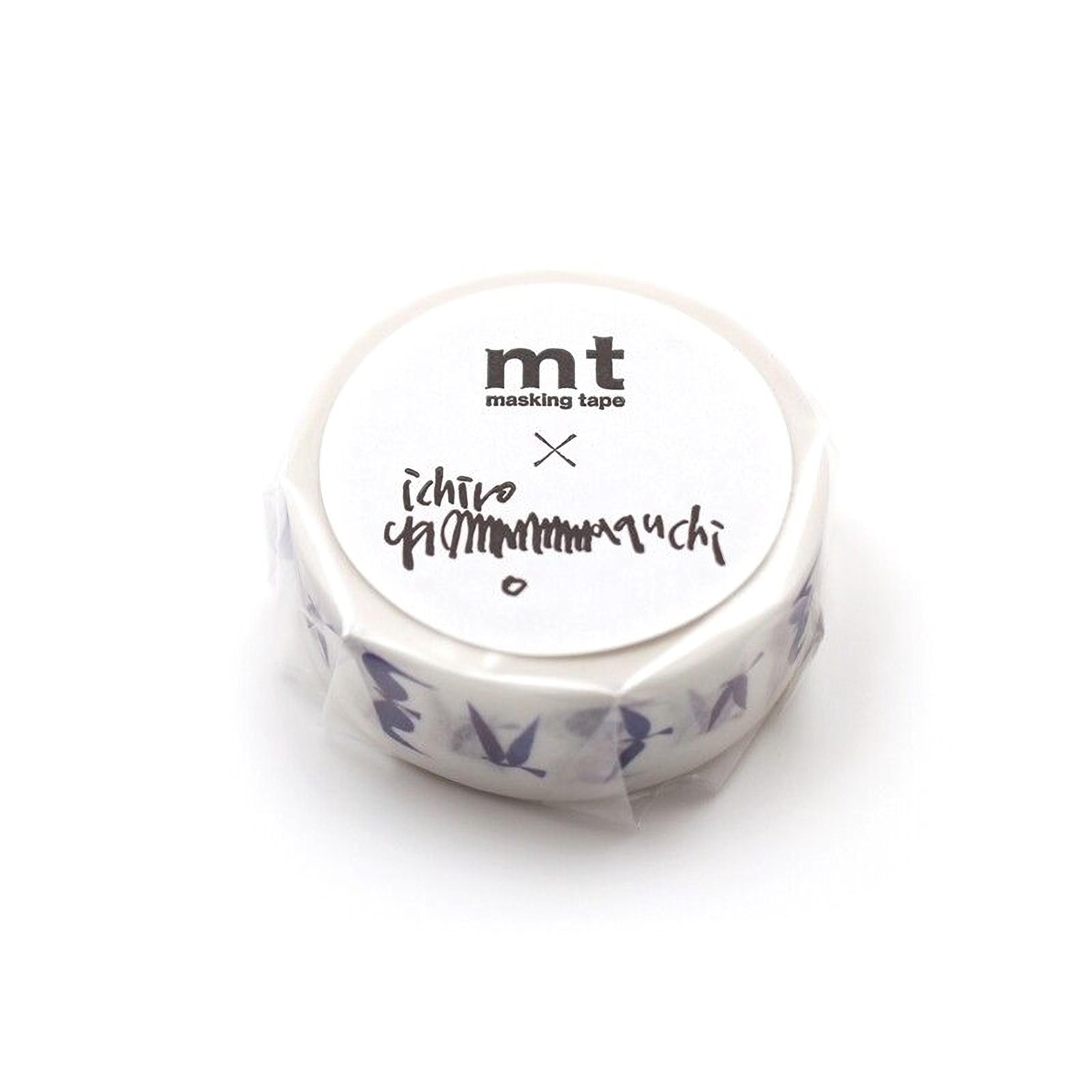 A round, white, and blue tape dispenser with the text "mt masking tape" printed on it.