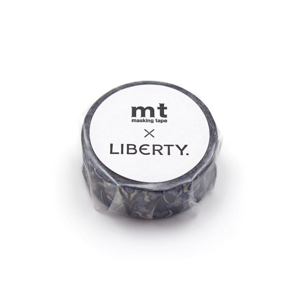 A round, black and white masking tape roll with the text "mt masking tape LIBERTY." printed on it.