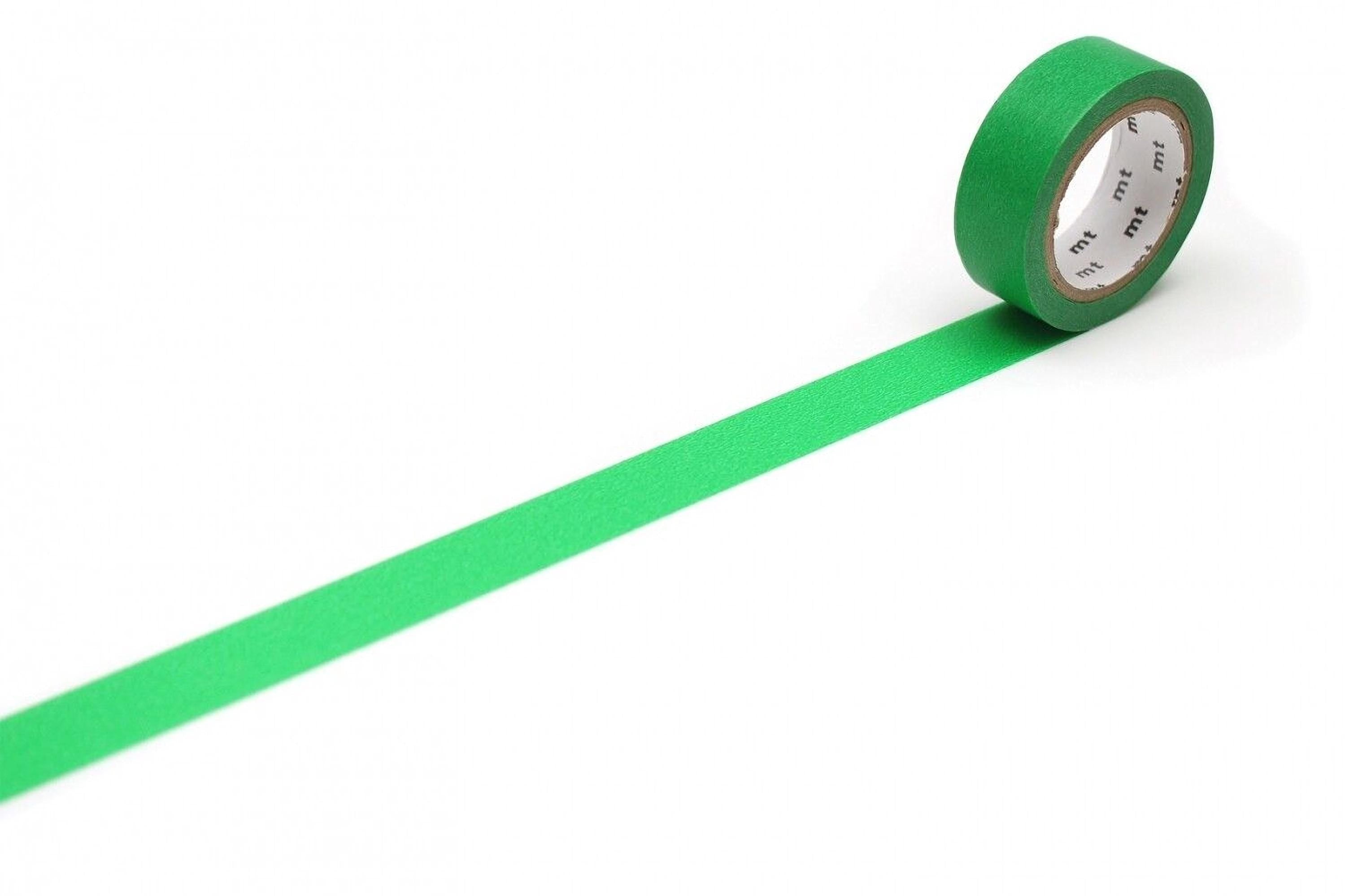 A roll of green tape with a white label is placed on a white surface, with the tape extending across the image.